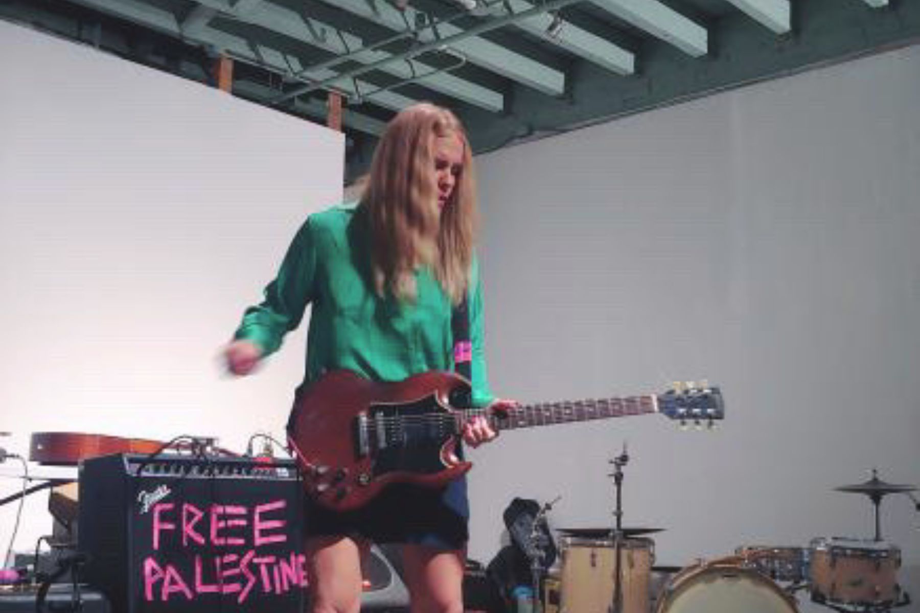 Erica shredding at an indoor concert. #freepalestine